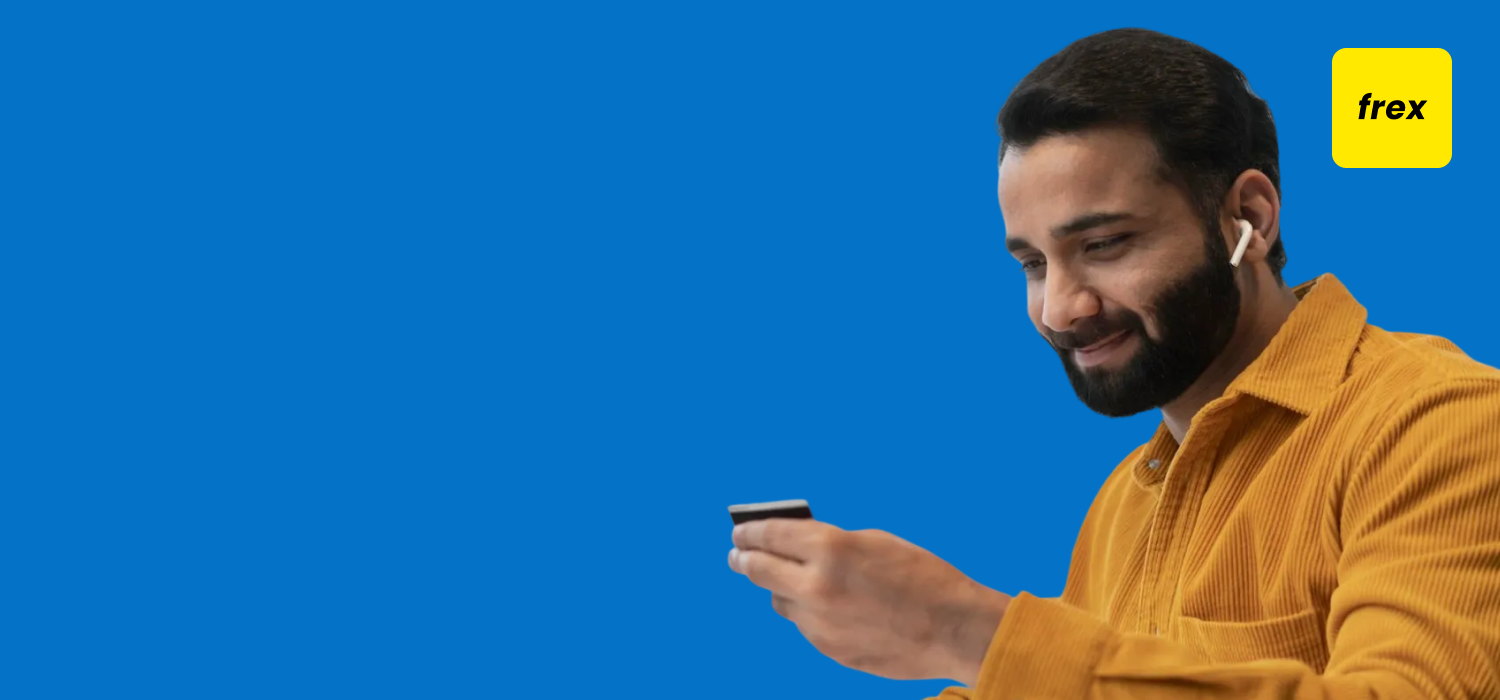 Man holding his phone and smile