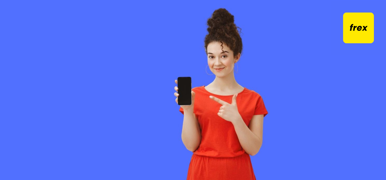 Young girl pointing at phone